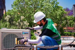 HVAC Tune-Up Professional Home Upgrade Specialist technician expertly servicing an HVAC system.
